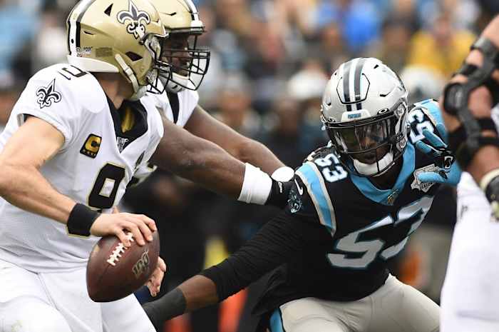Former Saints quarterback Drew Brees (9) with the ball as Carolina Panthers Brian Burns (53) pressures. Mandatory Credit: Bob Donnan-USA TODAY